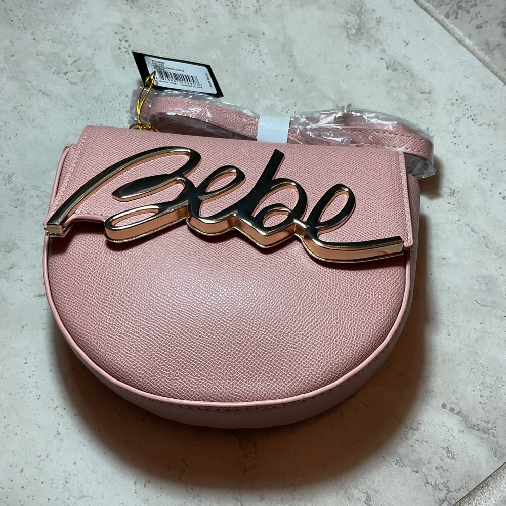 “Bebe Gabriel Saddlebag” blush crossbody with Gold Accents, NWT
